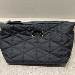 Very gently used Kate Spade cosmetic bag in black.